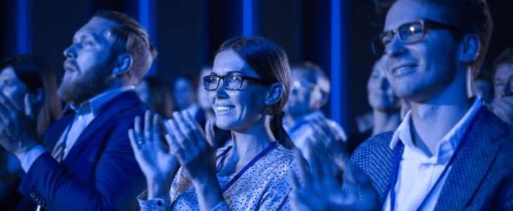 convention attendees clapping